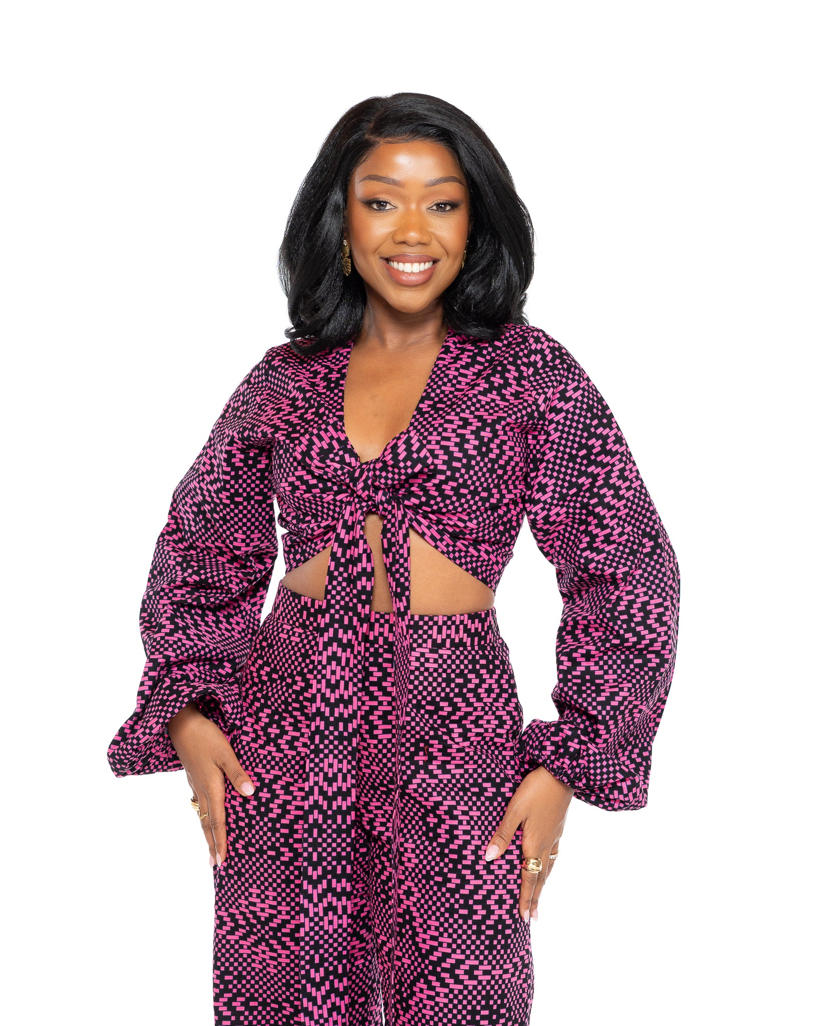 Pink and black Ankara African print wrap top with long voluminous sleeves, tie-front design, and cropped length for women in Kenya.